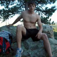 boy in mesh shorts about to jerkoff